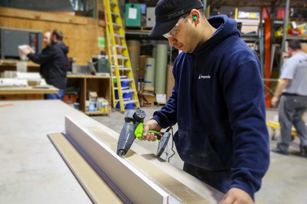 Image of Worker Gluing Panels